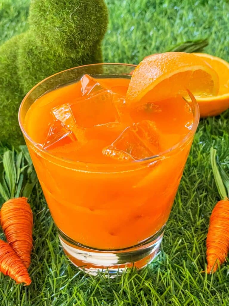 Close view of an orange Bunny Tonic Cocktail on grass