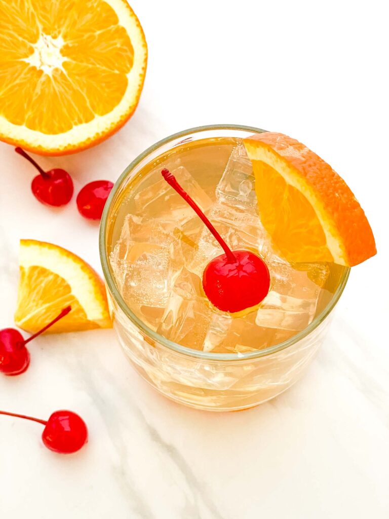 Looking down on an Easy Amaretto Sour Recipe with Sour Mix glass on a counter.